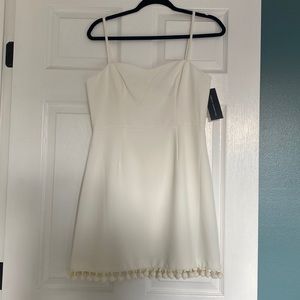 French Connection white mini dress with pom poms